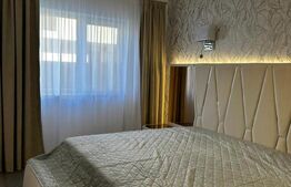 Apartament 2 camere, ultrafinisat, mobilat si utilta, 40 mp gradina si parcare