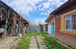 Casa modesta, 651 mp teren, zona Romanesti