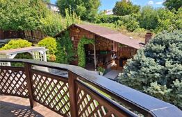 Proprietate elegantă cu teren mare și garaj în Bucium, perfectă pentru familie